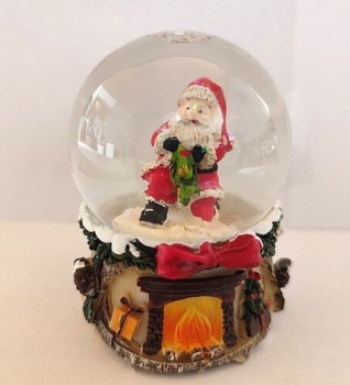 Snow globe Santa Claus kneeling