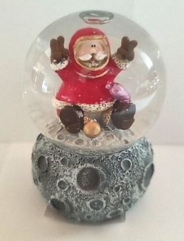 Snow globe Santa Claus on the moon with amphora
