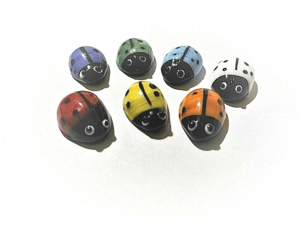 7 colorful glass ladybugs sorted