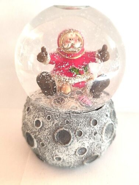 Snow globe Santa Claus on the moon with amphora