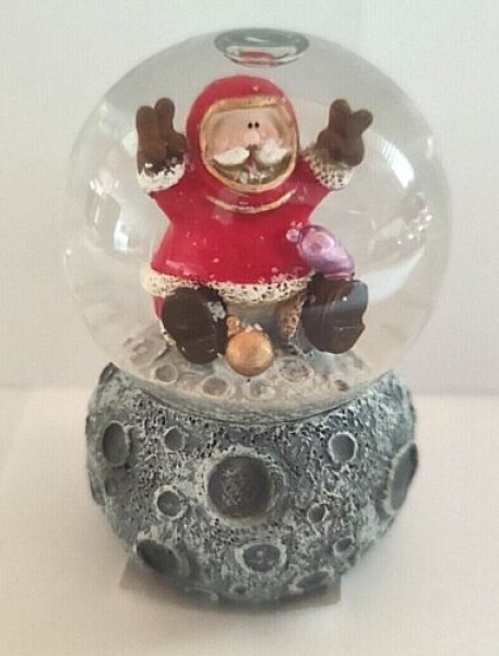 Snow globe Santa Claus on the moon with amphora